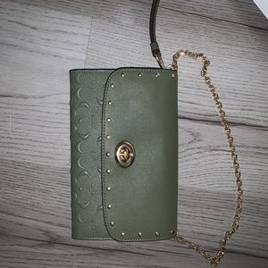 Coach turnlock embossed wristlet with added chain.